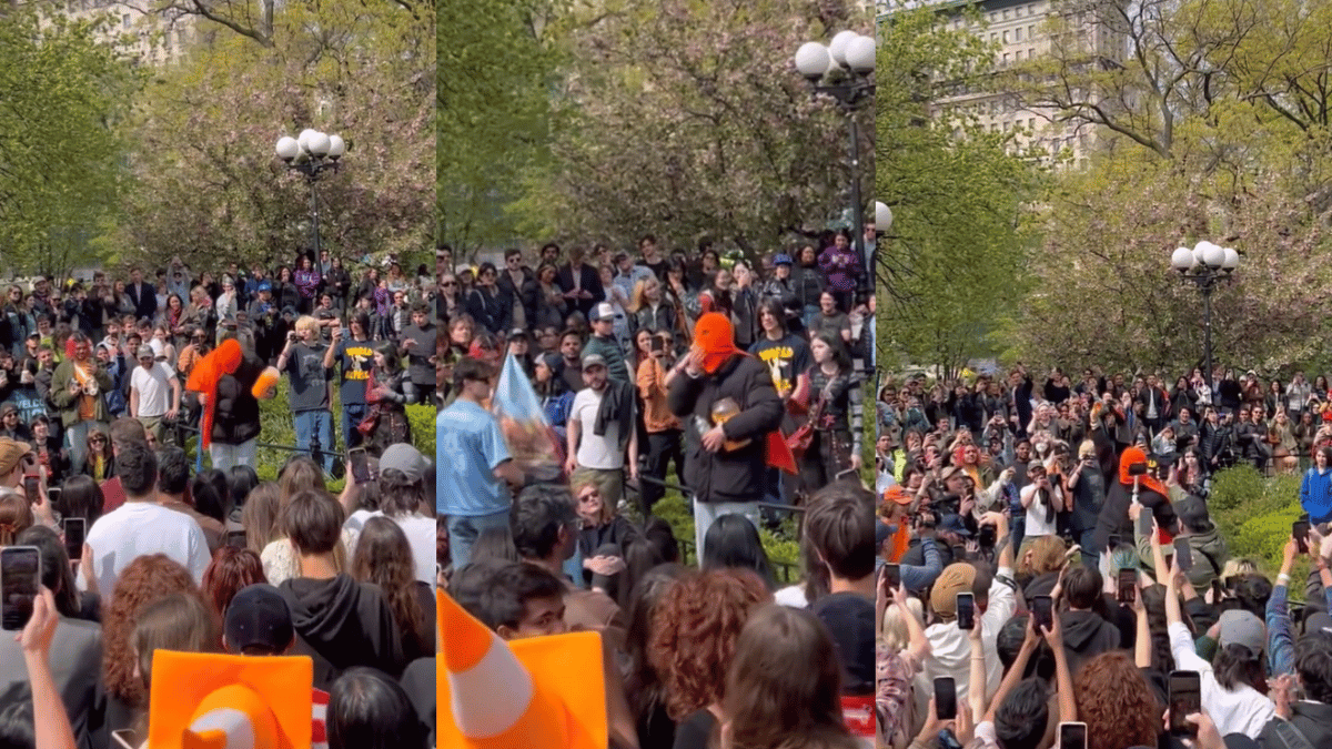 hundreds-gather-up-to-watch-masked-man-eat-tub-full-of-cheeseballs-viral-video